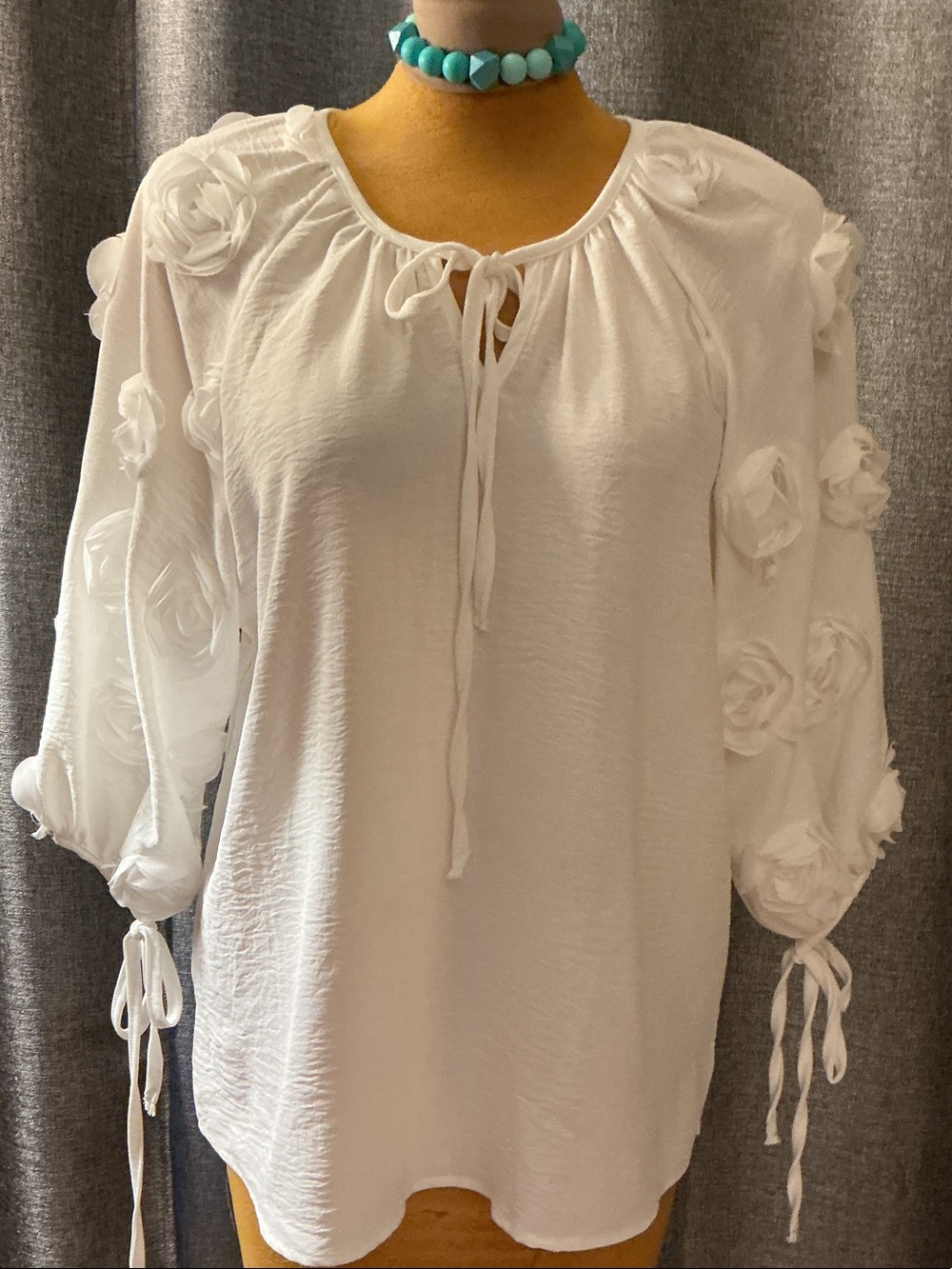 Women's White Tie-Neck Blouse with Rosette Sleeve Detail